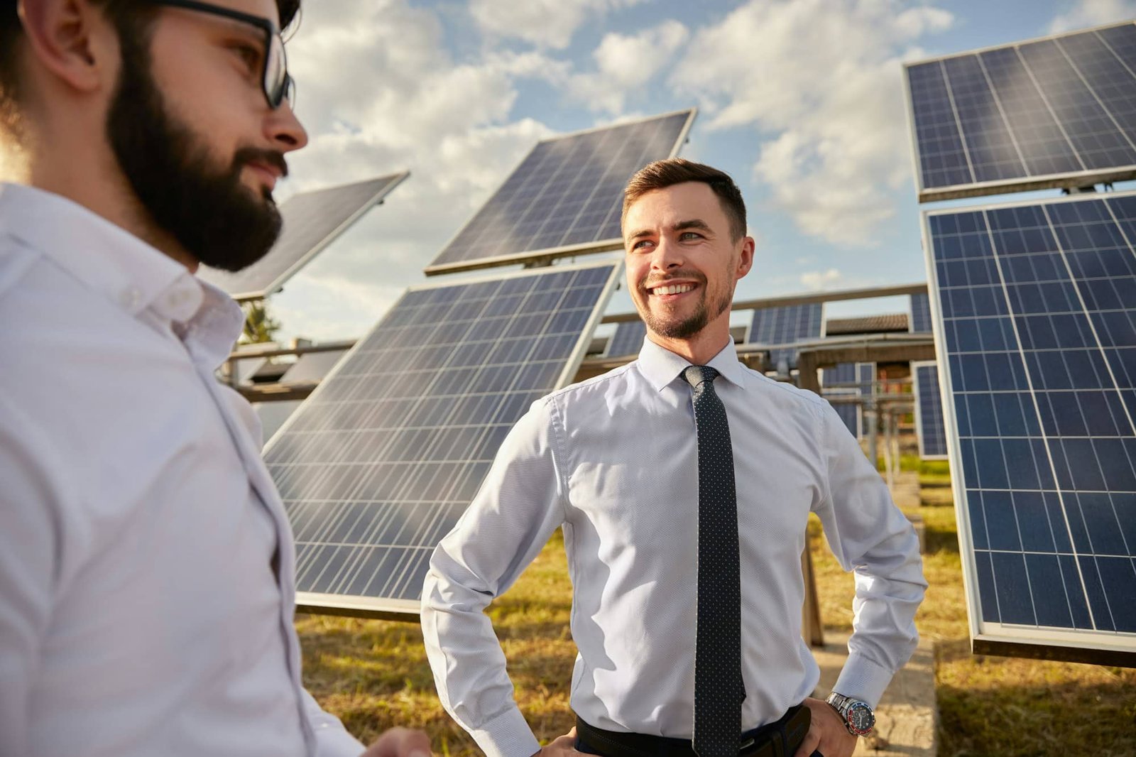 Engineers in field with solar panels